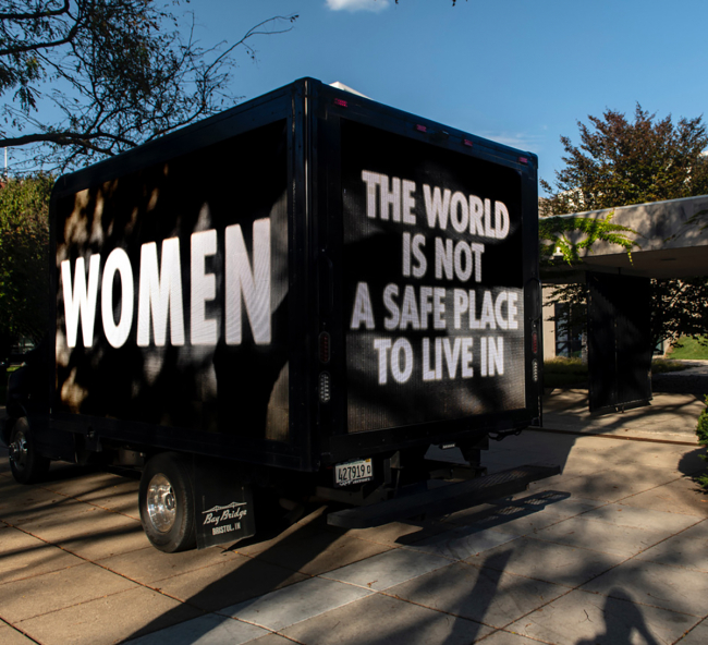 Truck with text "Women - This world is not a safe place to live in."