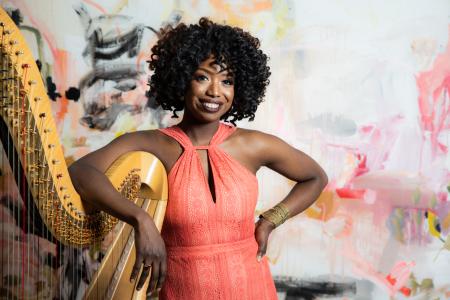 Brandee Younger posing with Harp