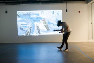 A person playing a Virtual Reality game.