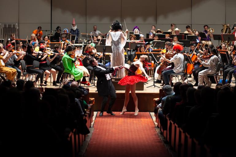 The University Symphony Orchestra performs in costume with Maestra Barbara Schubert and students from the Hyde Park School of Dance