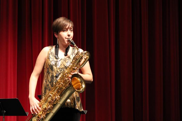 Allison Balcetis playing baritone saxophone