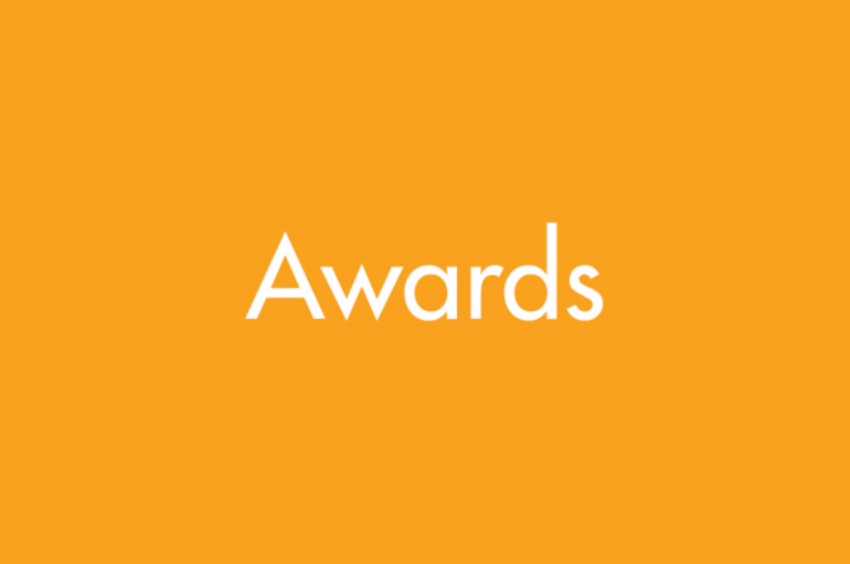 Graphic with a yellow background and white text reading "awards"